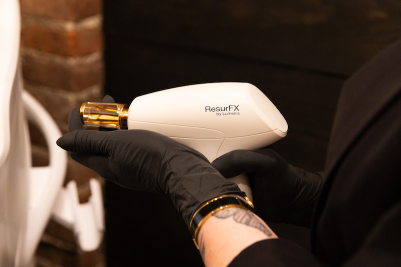 A Hudson Valley Beauty Lab skin expert is holding up a ResurFX laser for laser skin resurfacing in Washingtonville, NY.