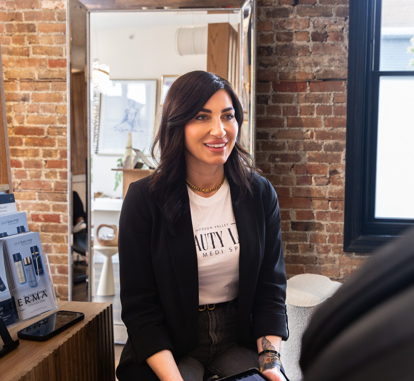 A woman has come into Hudson Valley Beauty Lab for a consultation for lip filler in Newburgh, NY.