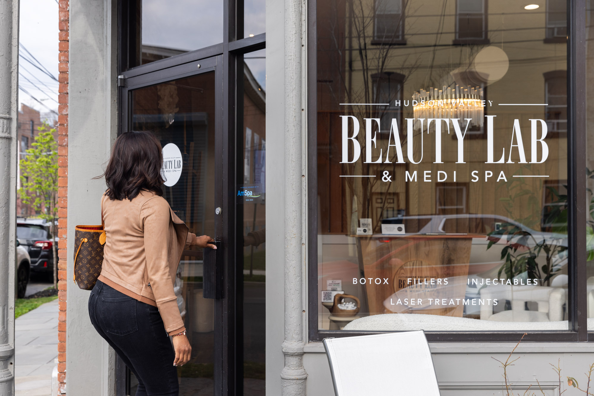 A woman is walking into the HVBL office for her appointment for dermal filler in Newburgh, NY.